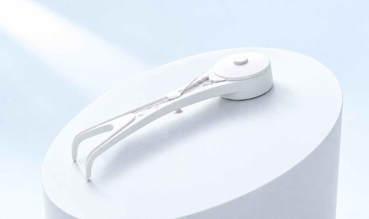 White Flossy showing its curved handle, fork and floss